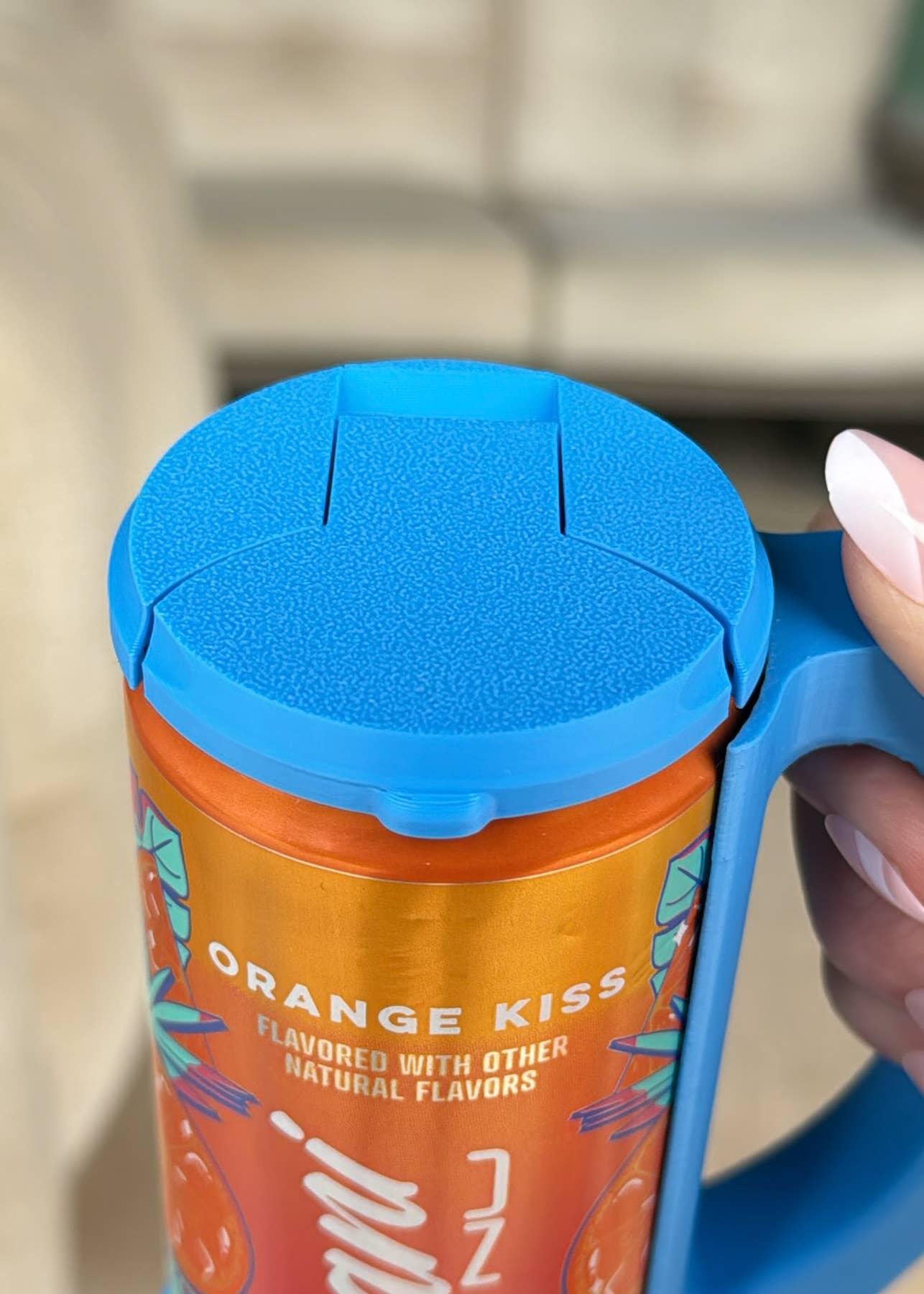 Close-up of a magenta-colored skinny can holder lid with a design that includes the text 'Hotline' and 'Chill', and a depiction of a can.