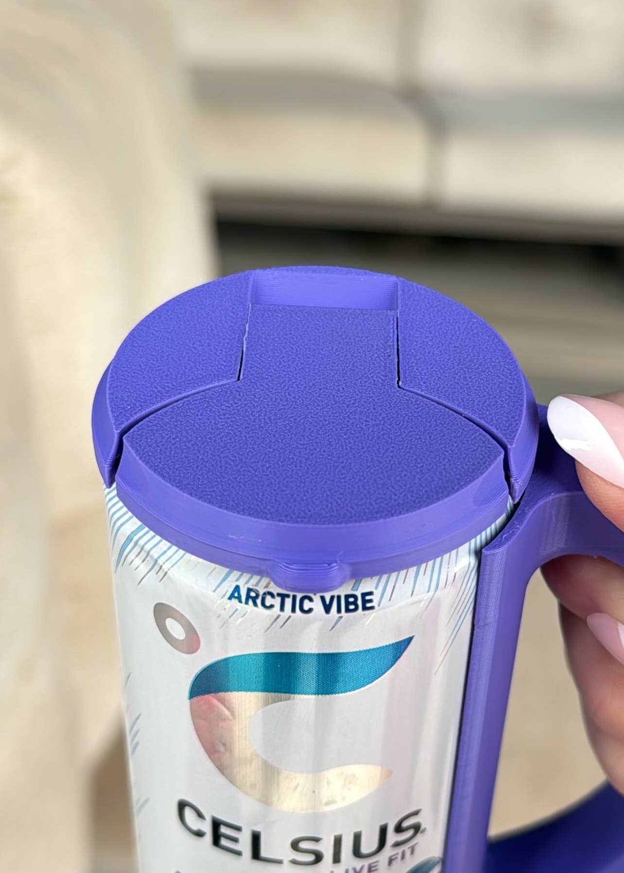 Close-up of a magenta-colored skinny can holder lid with a design that includes the text 'Hotline' and 'Chill', and a depiction of a can.