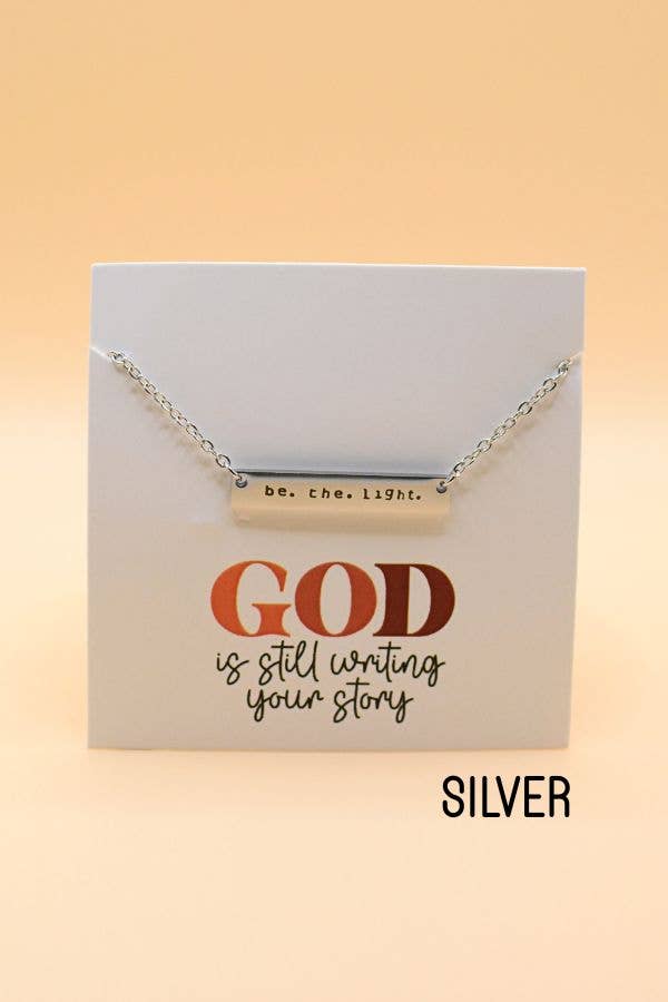 Necklace with bar pendant on a card with text, on a beige background