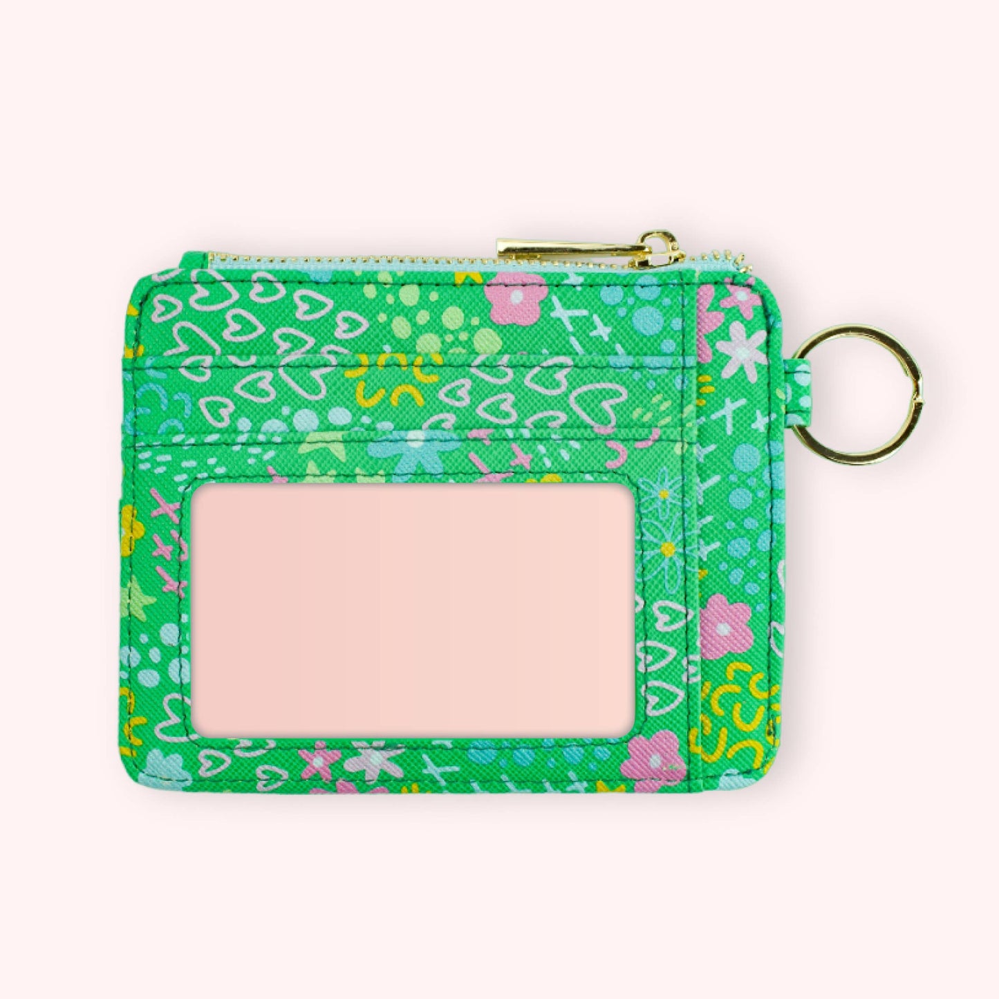 A green faux leather wallet keychain with a floral pattern with a key ring and strap attached.