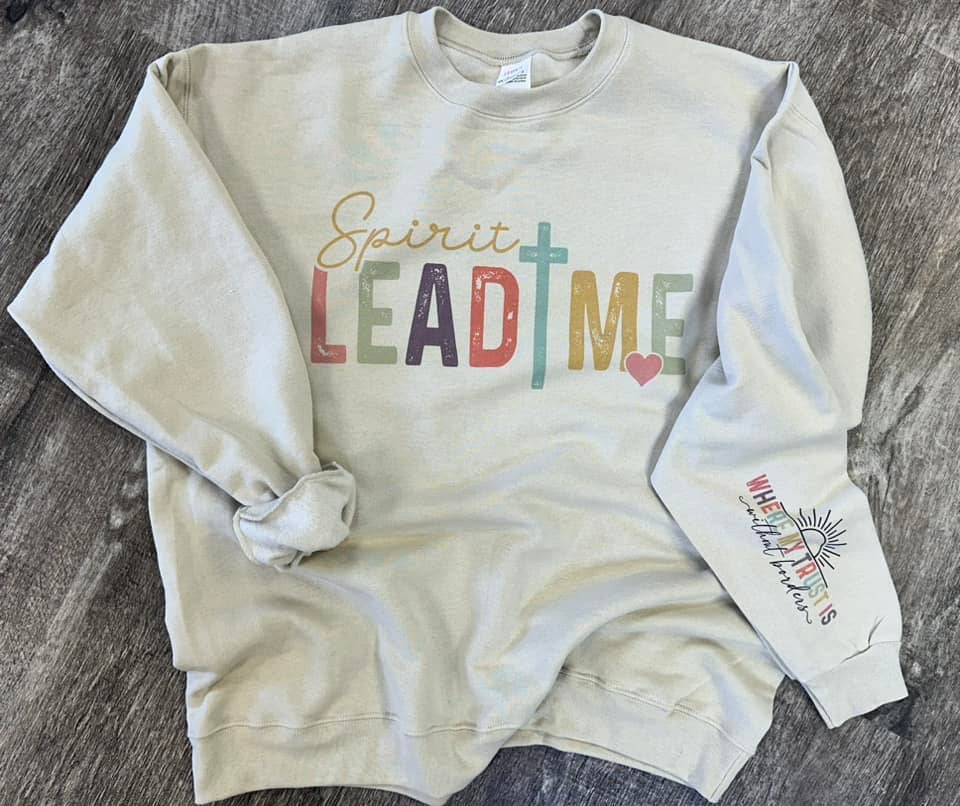 A unisex sweatshirt with the text 'Spirit Lead Me' printed on the front and a smaller text on the sleeve that reads 'Where my trust is without borders.'.