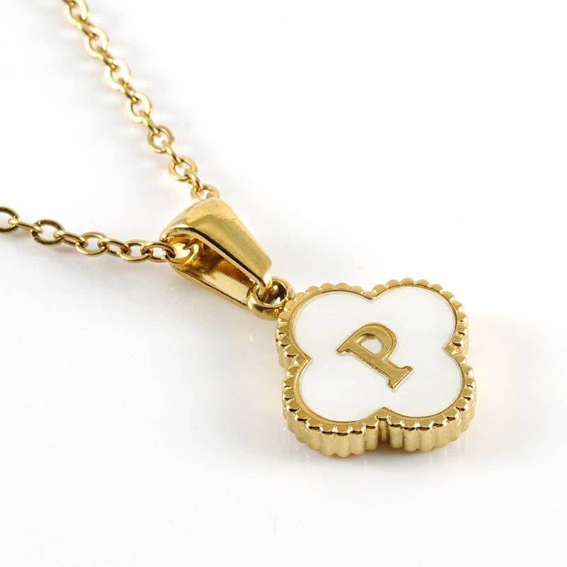 Gold necklace with a clover-shaped pendant featuring the letter 'P' on a white background