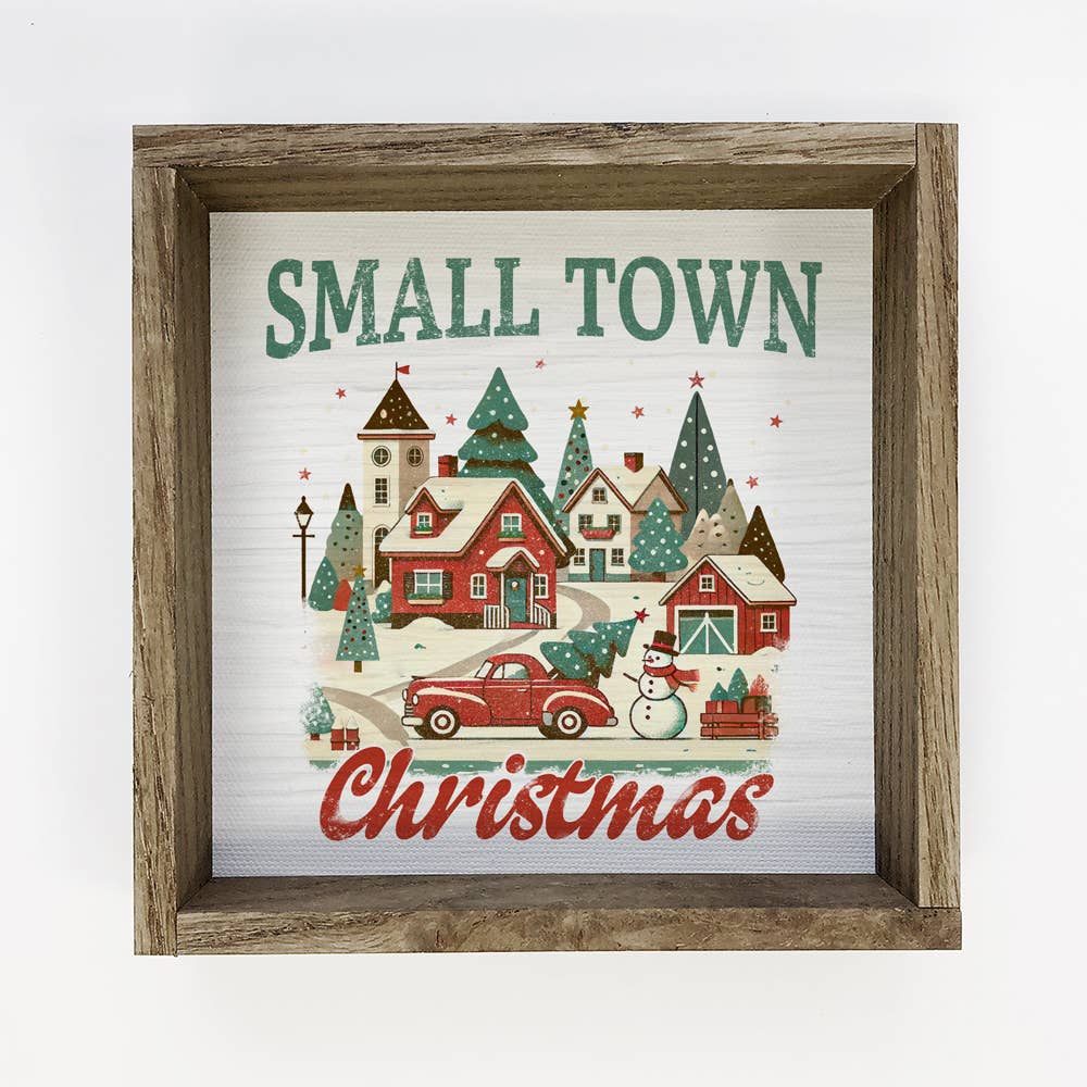 Framed Christmas-themed artwork with a small town scene and 'Small Town Christmas' text.
