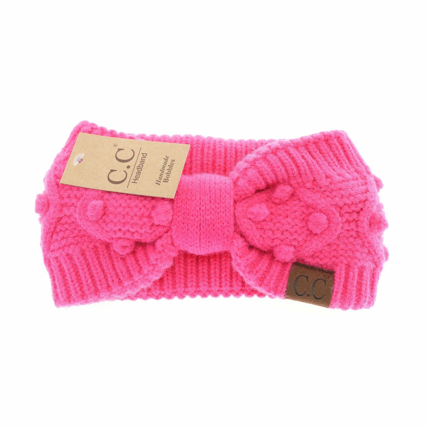  hot Pink knitted headband with a bow on a white background