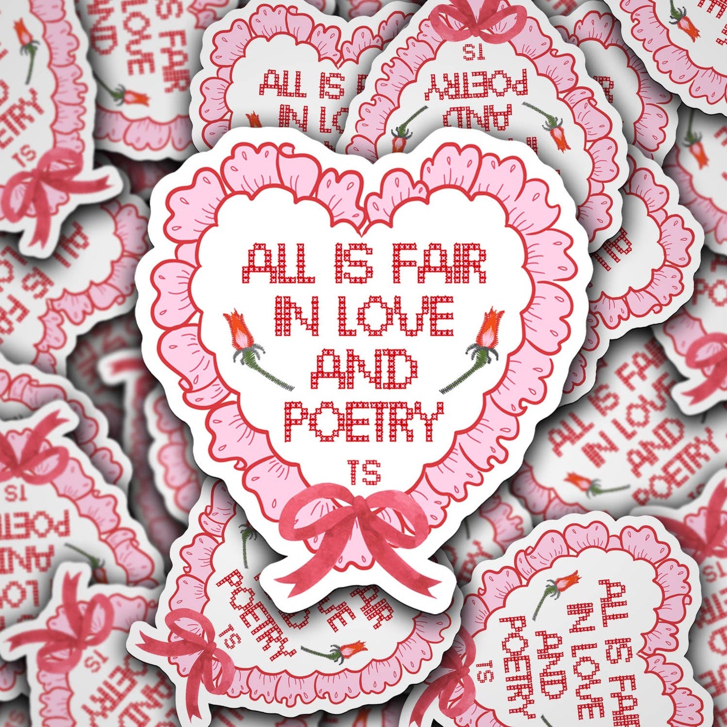 A vinyl decal with a heart shape and the phrase 'All is fair in love and poetry', with a glossy finish.
