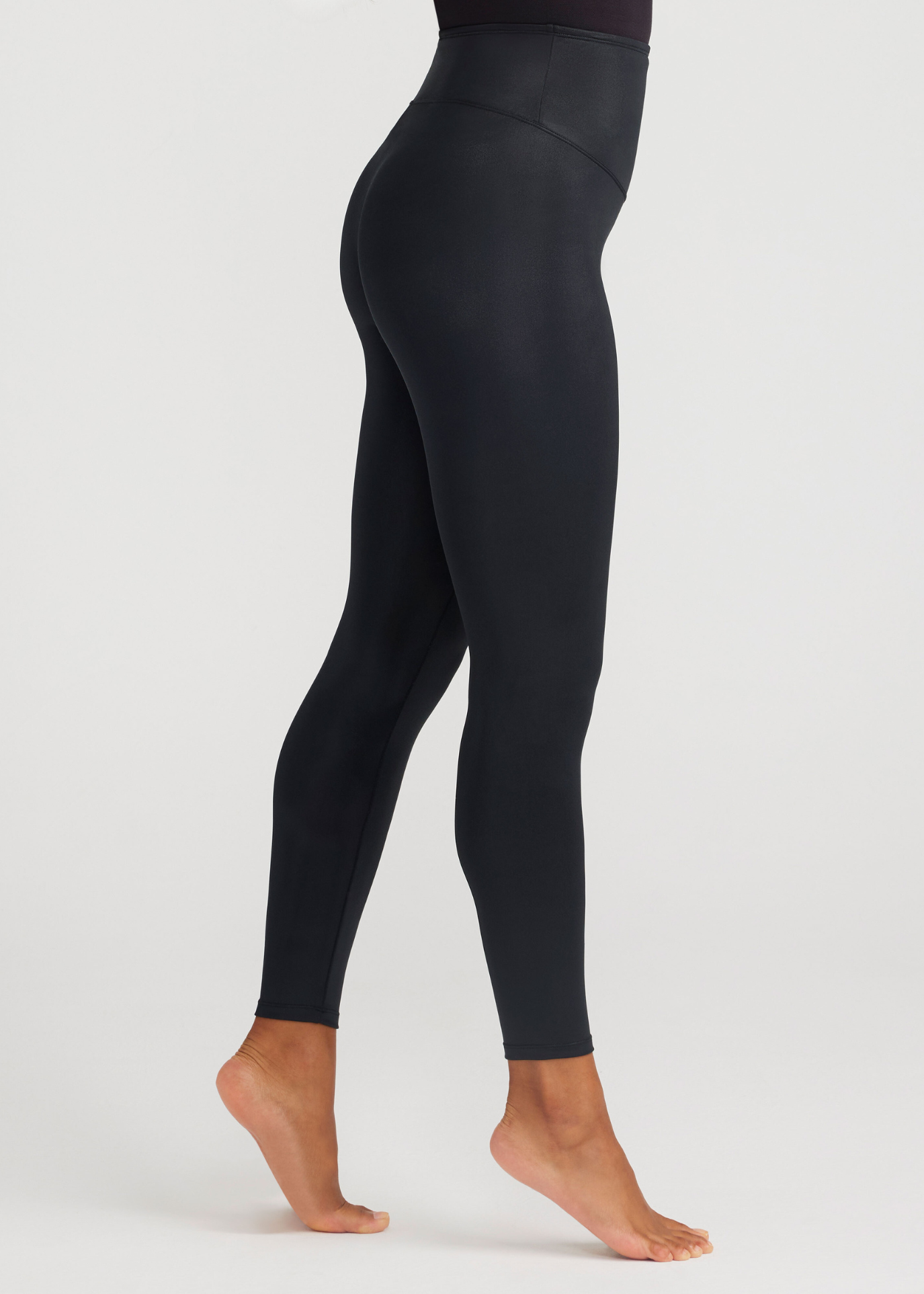 Woman standing side ways with elektra leggings