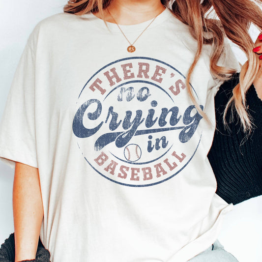 Person wearing a white t-shirt with 'There's no crying in baseball' text and graphic.
