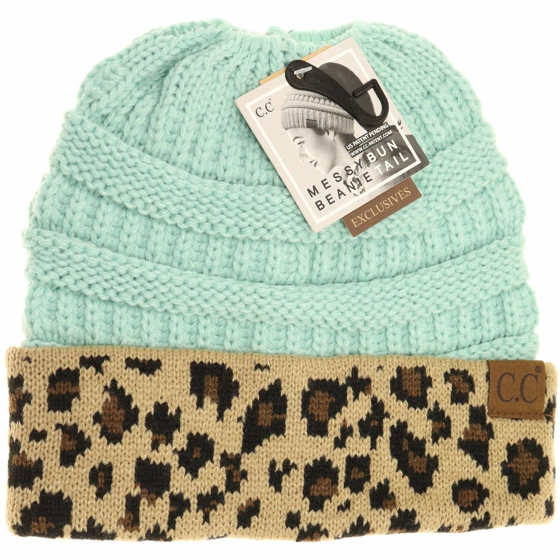 Light blue beanie with leopard print band and C.C tag on a white background