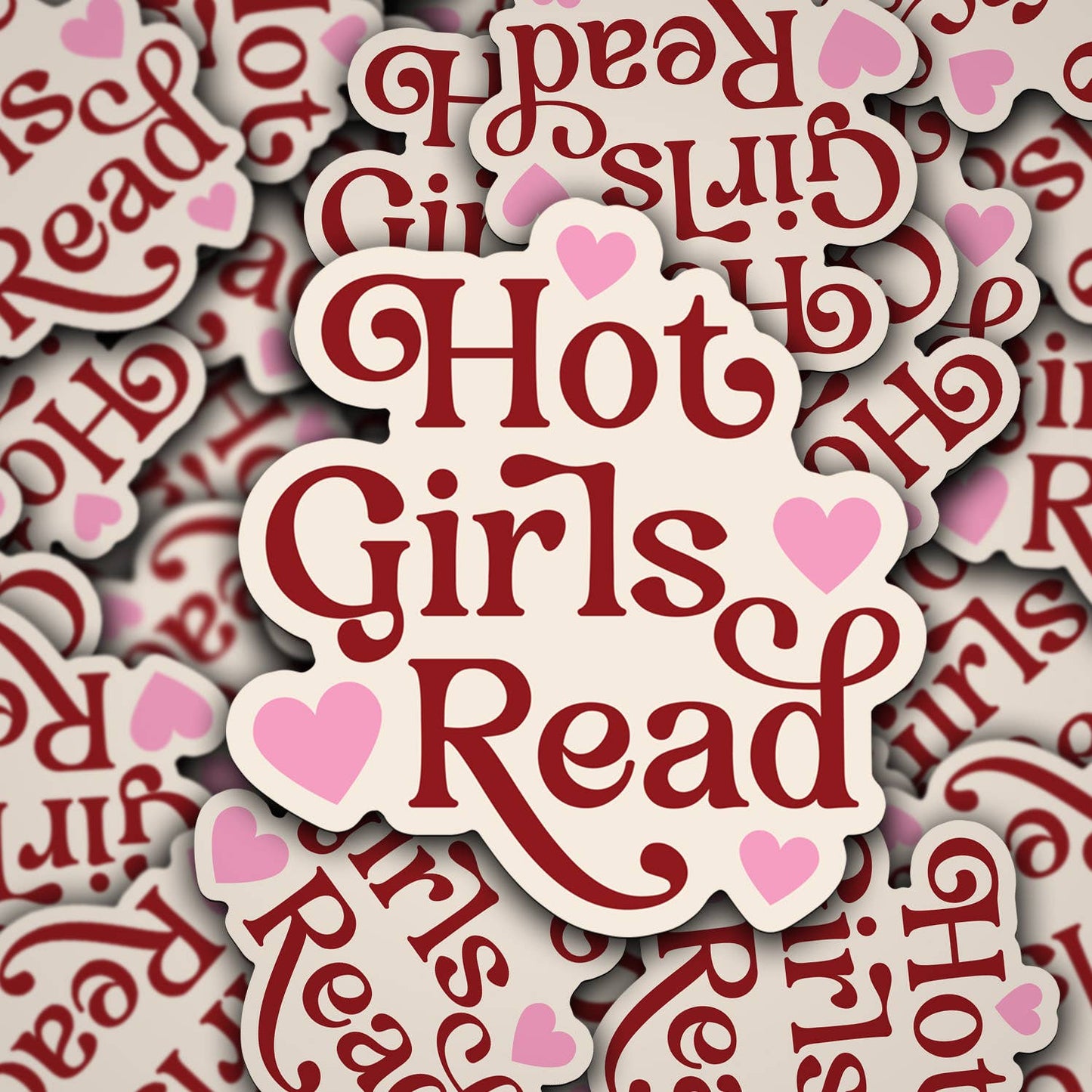A vinyl decal with the phrase 'Hot Girls Read' printed in red and pink colors on a white background, with heart accents.