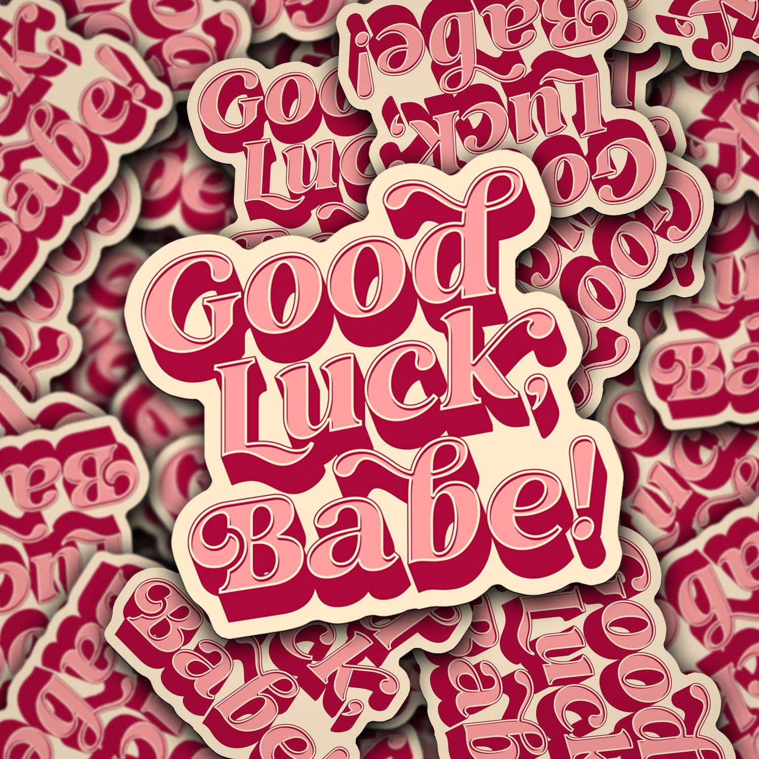 A collection of vinyl decals with the phrase 'Good Luck Babe' in various shades of pink and red.