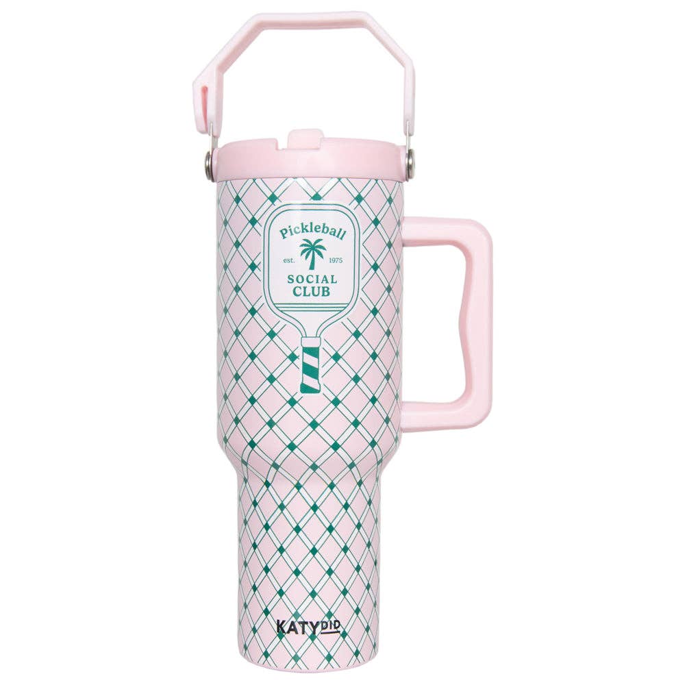 A hand holding a pink and green plaid designed tumbler with a handle and a logo that reads 'Pickleball Social Club'.