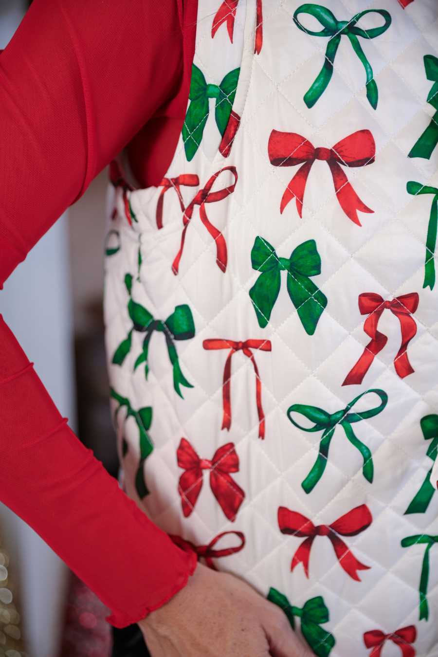 Quilted fabric with red and green bows pattern