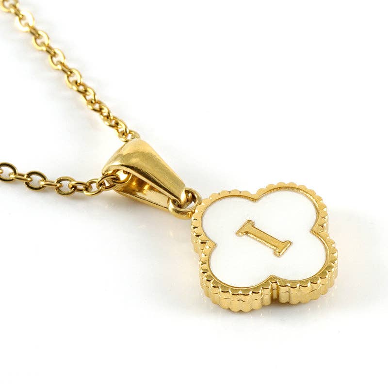 Gold necklace with a clover-shaped pendant featuring the number '1' on a white background