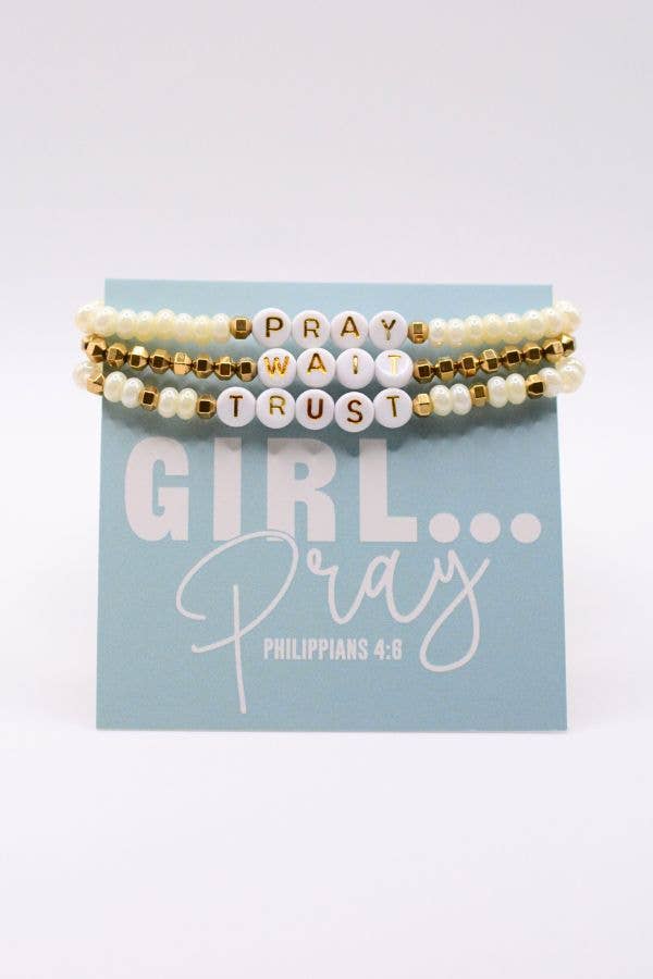 Set of three beaded bracelets with motivational text on a blue card with inspirational quote