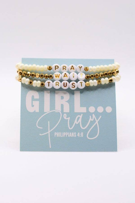 Set of three beaded bracelets with motivational text on a blue card with inspirational quote